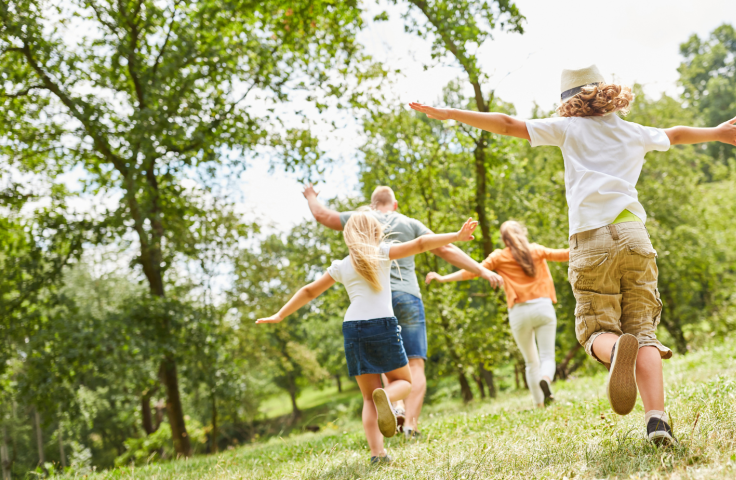 children running and playing in a park